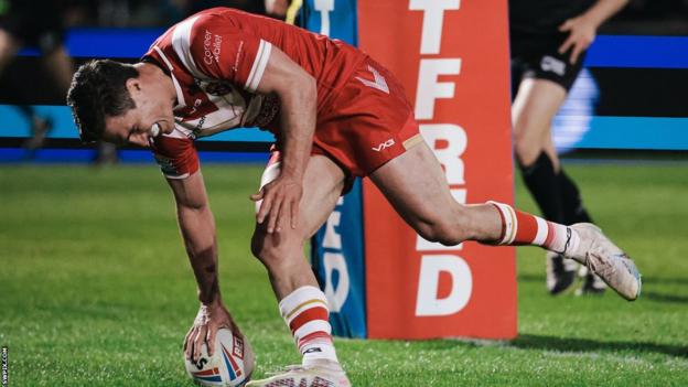 Brodie Croft touches a try down for Salford under the posts