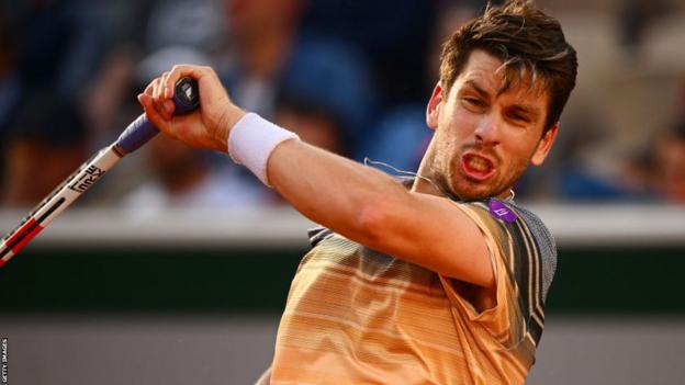 Cameron Norrie returns a ball during his French Open match against Lorenzo Musetti