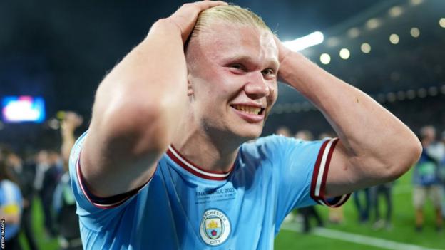 Manchester City striker Erling Haaland puts his hands on his head after winning the Champions League