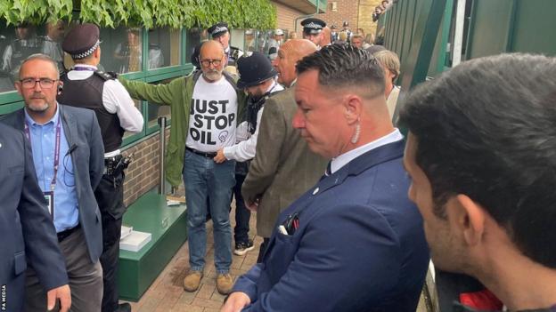 Police arrest a Just Stop Oil protester at Wimbledon