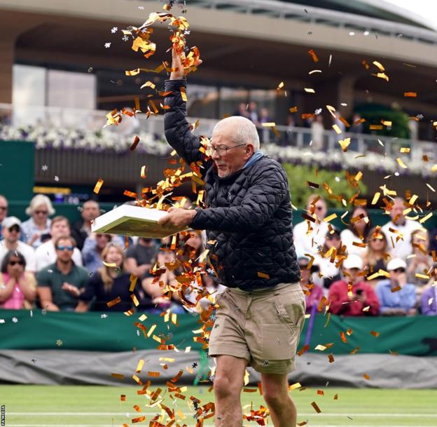 A third protester interrupts play again on Court 18