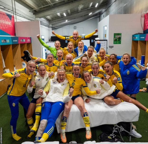 Sweden's players celebrate in the dressing room after defeating Japan to reach the semi-finals of the Fifa Women's World Cup