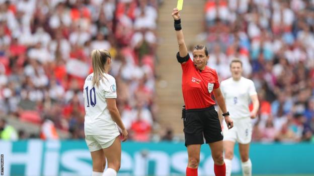 Georgia Stanway is shown a yellow card during the Euro 2022 final