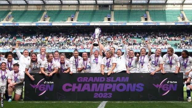 Marlie Packer holds up the Six Nations trophy