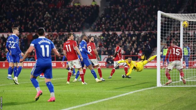 Forest goalkeeper Odysseas Vlachodimos can only dive in despair as he watches Dwight McNeil's goal sail past him and high into the net