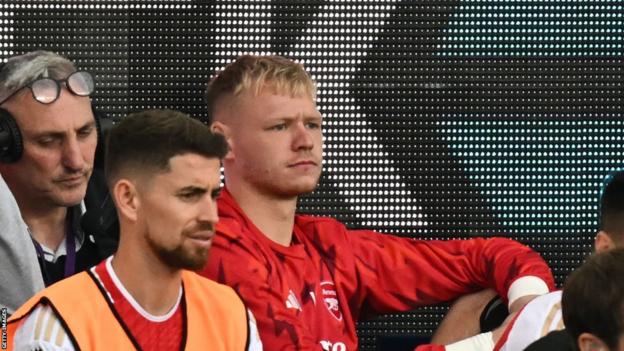 Aaron Ramsdale looks on from the bench for Arsenal