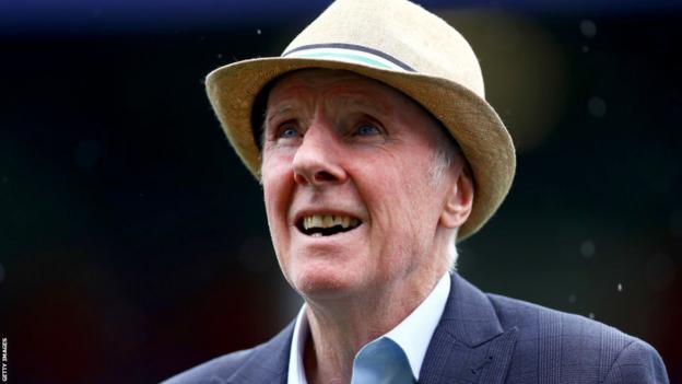 Former player Stan Bowles looks on from the pitch as he receives the applause of the fans before his benefit match and pre-season friendly match between Queens Park Rangers and AFC Bournemouth at Loftus Road on July 29, 2017